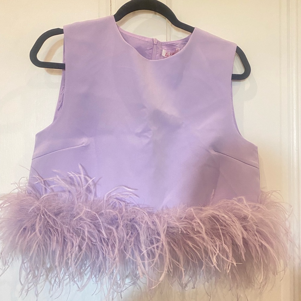 Purple feather top never worn (just bought to big)